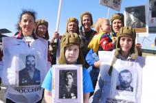 Тюменские "моржи" устроили акцию "Бессмертный полк" в воздухе, воде и на суше