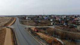 Временные земляные насыпи для защиты от паводка возвели на трассе в Абатском районе